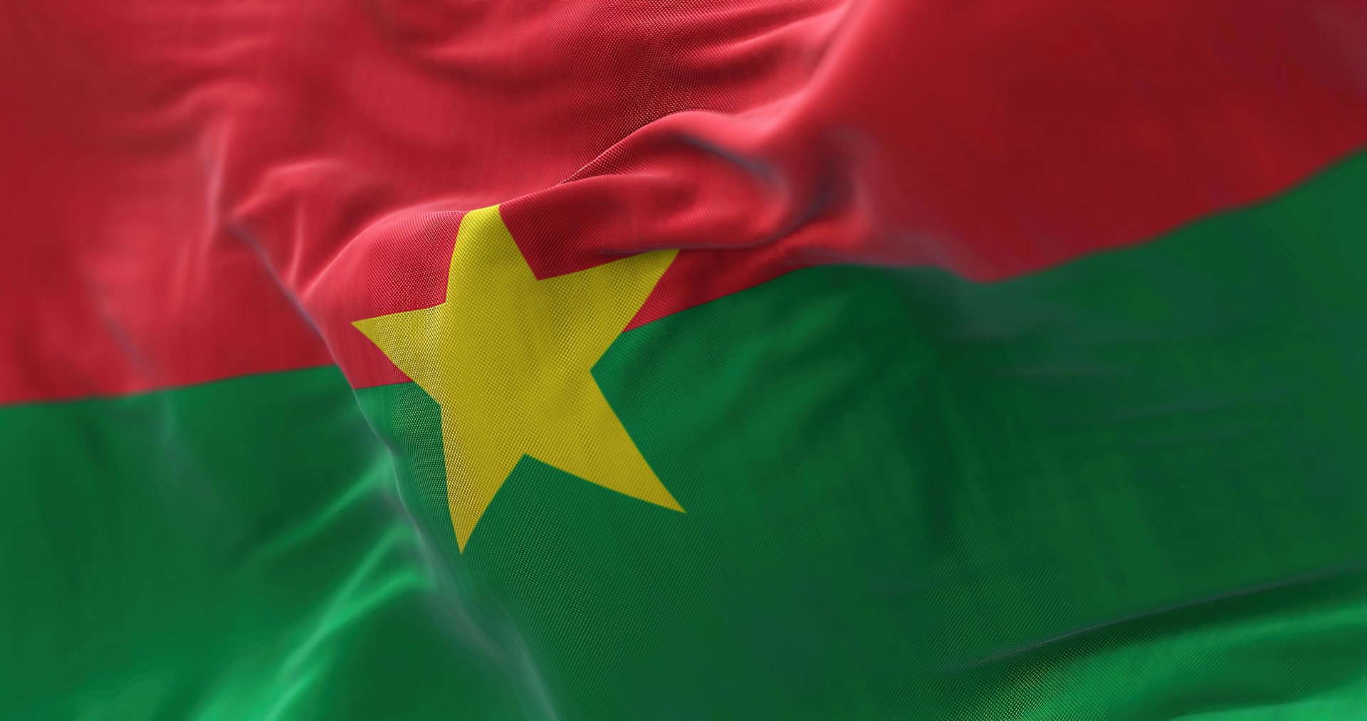 Close-up view of the Burkina Faso national flag waving in the wind
